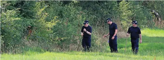  ?? PETER BYRNE ?? Police searching near Tickhill Lane in Caverswall, near Stoke, for missing midwife Samantha Eastwood yesterday