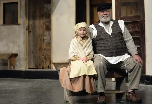  ?? AARON HARRIS PHOTOS FOR THE TORONTO STAR ?? Nicole de Jong, 8, is the youngest member of Westben’s Fiddler on the Roof cast and John Scott, 77, is the oldest. The non-profit community theatre draws volunteers from throughout Ontario.