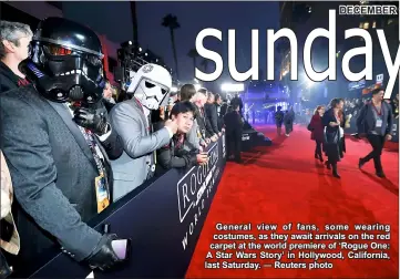  ??  ?? General view of fans, some wearing costumes, as they await arrivals on the red carpet at the world premiere of ‘Rogue One: A Star Wars Story’ in Hollywood, California, last Saturday. — Reuters photo