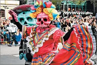  ?? GETTY ?? Mexico City only recently began holding elaborate parades tied to the holiday after a fictional version was depicted in a 2015 James Bond film.