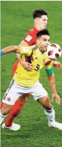  ??  ?? England’s John Stones (background) fights for the ball with Colombia’s Radamel Falcao during the roundof-16 match between Colombia and England at the 2018 World Cup in the Spartak Stadium, in Moscow, Russia, on Tuesday.