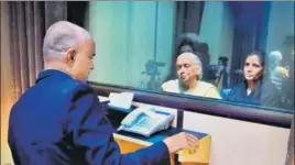  ?? PTI ?? Former Indian Navy officer Kulbhushan Jadhav interacts with his wife Chetankul and mother Avanti while seated across a glass partition at the Pakistan foreign office in Islamabad on Monday.