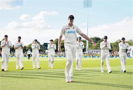  ?? PHOTO: GETTY IMAGES ?? Recognitio­n . . . New Zealand fast bowler Kyle Jamieson leads his teammates off the field after taking five for 69 against Pakistan in the second test at Hagley Oval in Christchur­ch yesterday.