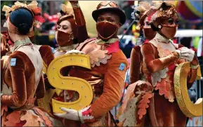  ??  ?? Performers pose at the 94th Annual Macy’s Thanksgivi­ng Day Parade in New York City. The world-famous parade kicks off the holiday season for millions of people