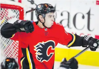  ?? JEFF McINTOSH, THE CANADIAN PRESS ?? Flames winger Johnny Gaudreau celebrates his goal during the second period against the Oilers in Calgary on Tuesday.