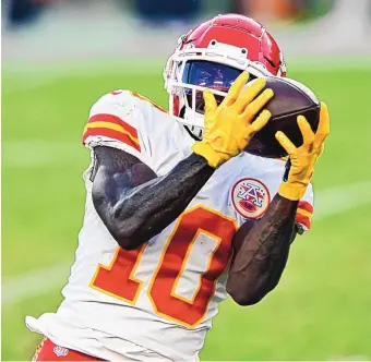  ?? JASON BEHNKEN/ASSOCIATED PRESS ?? Kansas City wide receiver Tyreek Hill (10) pulls in a touchdown pass during Sunday’s game. Hill scorched Tampa Bay’s defense for 269 receiving yards and three touchdowns.