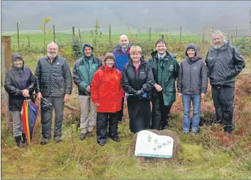  ?? 02_41whitebea­m02 ?? Baroness Goldie with members of the Botanical Garden Edinburgh, Scottish Natural Heritage, Arran Trust and the Arran Forestry Commission at the plot