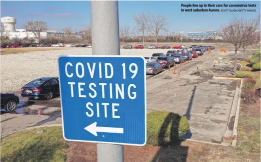  ?? SCOTT OLSON/ GETTY IMAGES ?? People line up in their cars for coronaviru­s tests in west suburban Aurora.