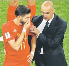  ??  ?? Belgium’s midfielder Yannick Ferreira-Carrasco (left) is consoled by Belgium’s coach Roberto Martinez at the end of the World Cup semi-final football match between France and Belgium at the Saint Petersburg Stadium in Saint Petersburg. — AFP photo