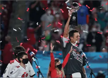  ?? STEPHEN M. DOWELL/ORLANDO SENTINEL ?? Tampa Bay Buccaneers quarterbac­k Tom Brady celebrates after winning Super Bowl LV against the Kansas City Chiefs on Sunday in Tampa, Fla.