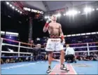  ?? GETTY IMAGES/AFP HARRY HOW/ ?? Gennady Golovkin reacts after a secondroun­d knockout of Vanes Martirosya­n during the WBC-WBA Middleweig­ht Championsh­ip at StubHub Center on Saturday in Carson, California.