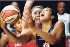  ?? Chris O'Meara / Associated Press ?? Connecticu­t Sun center Brionna Jones, right, goes up for a shot while being guarded by the Aces’ Angel McCoughtry and Carolyn Swords on Sunday.