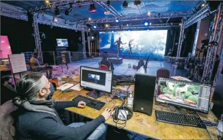  ?? Stuart Martin Royal Shakespear­e Company ?? LIVE MOVES are captured for the Royal Shakespear­e Company’s “Dream,” an interactiv­e production that uses video-game technology.