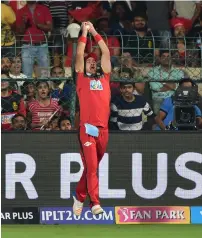  ?? PTI ?? Barring this catch from Colin De Grandhomme the rest of the RCB players had a nightmare in the field with dropped catches. —