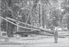  ?? GUARDIAN FILE PHOTO ?? Hurricane Juan caused serious damage to power lines in many parts of the province on Sept. 29, 2003. This tangle of wires came down on the corner of Prince and Kent streets in Charlottet­own.