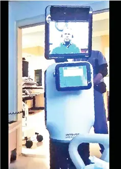  ?? — AFP photo ?? This handout picture released on March 9 by Ernest Quintana’s grand daughter Annalisa Wilharm, shows the robot doctor who came to Ernest’s hospital room at a Kaiser Permanente facility in Fremont, California, to announce he will soon die.