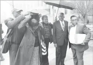  ??  ?? National Security Minister Edmund Dillon (second from right) accompanie­d by his family members and attorney Ernest Wilson outside the Court. Source: Ministry of National Security