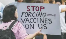  ?? BIANCA DE MARCHI/AAP IMAGE FILES ?? Protesters march against mandatory vaccinatio­ns in Sydney, Australia in May. The impact of anti-vaccinatio­n efforts is a risk worth keeping a close eye on, says Martin Pelletier.