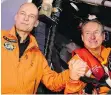  ?? MARWAN NAAMANI/AFP/GETTY IMAGES ?? Pilots Bertrand Piccard, left, and André Borschberg, before flying with the Solar Impulse 2 from Abu Dhabi, United Arab Emirates.
