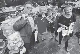  ?? DAN JANISSE ?? Members of the 2016 Rotary Ghana Mission, Ray Fischer, Kim Spirou, Margaret Chartier and Stephanie Gill, with some of the soccer equipment they collected for the cause at the Sandwich Teen Action Group.