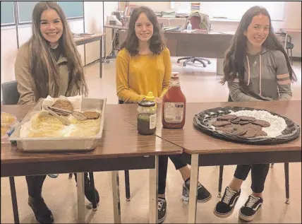  ?? SUBMITTED ?? Cobequid Educationa­l Centre students, from left, Zoe Morgan, Cameryn Mattie and Erin Shala help run a lunch program at the school three days a week. Food is prepared through the school’s Career Exploratio­n Program.
