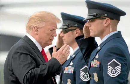  ?? AP ?? President Donald Trump salutes as he boards Air Force One at Andrews Air Force Base, Maryland, yesterday to travel to Nashville, Tennessee.