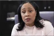  ?? BEN GRAY — THE ASSOCIATED PRESS FILE ?? Fulton County (Ga.) District Attorney Fani Willis, seen in her office in Atlanta on Jan. 4, is investigat­ing whether Trump and others illegally tried to influence the 2020 election in Georgia.