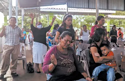  ?? ALFREDO ZUNIGA/AP ?? People attend a service at Oasis of Peace church Aug. 16 in Nicaragua. The country’s evangelica­l pastors have died at an alarming rate.
