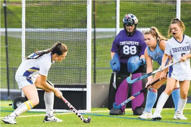  ?? TERRANCE WILLIAMS/CAPITAL GAZETTE PHOTOS ?? Southern’s Brenna Kadjeski attempts a shot during the first period of a field hockey game against Chesapeake on Tuesday in Harwood.