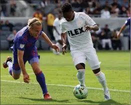  ?? PHOTO BY RAUL ROMERO JR. ?? Former Los Angeles FC forward Latif Blessing, right, is now with the New England Revolution and tonight will help his new team take on his old one at BMO Stadium.