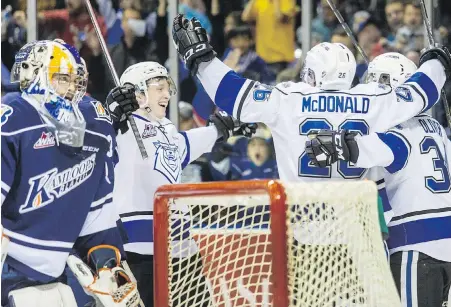  ??  ?? Royals defenceman Scott Walford, left, celebrates teammate Kody McDonald’s first-period goal behind Blazers goaltender Dylan Ferguson during action at Save-on-Foods Memorial Centre on Friday.