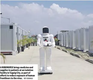  ?? ROY DOMINGO ?? A robonurse brings medicine and supplies to patients at an isolation facility in taguig City, as part of efforts to reduce exposure of human frontliner­s to the virus.