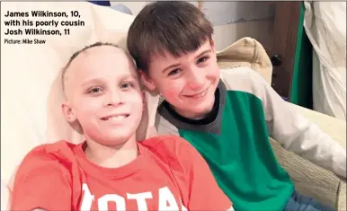  ?? Picture: Mike Shaw ?? James Wilkinson, 10, with his poorly cousin Josh Wilkinson, 11