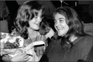  ?? The Associated Press ?? LOSS OF A LEGEND: Feminist activist Kate Millett, right, laughs, during a surprise birthday party for her niece, Kristan Vigard, in New York on May 21, 1979.