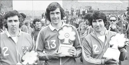  ??  ?? October 29, 1975, was another stand-out day in MickWallac­e’s love affair with the beautiful game. Republic of Ireland trio Paddy Mulligan, Don Givens (scorer of all four goals) and the recently-deceased Tony Dunne before the Euro 1976 qualifier against Turkey in Dalymount Park.
