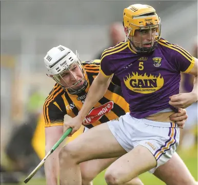  ??  ?? Teenage defender Damien Reck, a county Minor last year, is challenged close to the sideline by Kilkenny’s Liam B