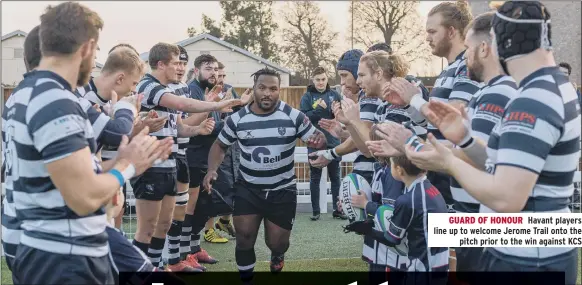  ??  ?? GUARD OF HONOUR Havant players line up to welcome Jerome Trail onto the pitch prior to the win against KCS