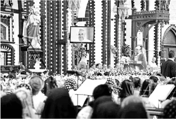  ??  ?? Pope Francis leads mass at the St. Mary’s Cathedral in Yangon. — AFP photo