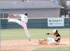  ?? MARK HUMPHREY ENTERPRISE-LEADER ?? Prairie Grove senior Michael Hutsell slides into second base during first day action of the Jarren Sorters Memorial Baseball Tournament hosted by Prairie Grove last week. The Tigers lost to Booneville, 12-3, on March 21.