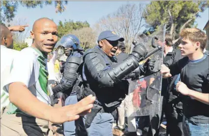  ??  ?? Breakup: Students and protesters clash at the University of the Free State in 2011. Police had to separate the opposing groups. Photo: Theo Jeptha/Foto24/Gallo Images