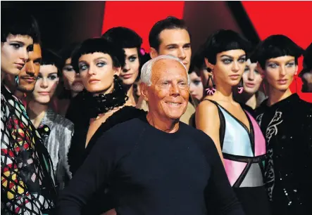  ?? ANDREAS SOLARO/AFP/GETTY IMAGES FILES ?? Giorgio Armani poses with models at his spring/summer show in Milan last month. He told the Corriere della Sera daily Monday that three people will be put in charge of his foundation in a bid to prevent his empire from breaking up.