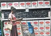  ?? TSVANGIRAY­I MUKWAZHI/AP ?? A shopper does a quick calculatio­n on her phone Wednesday before buying groceries at a store in Harare, Zimbabwe.