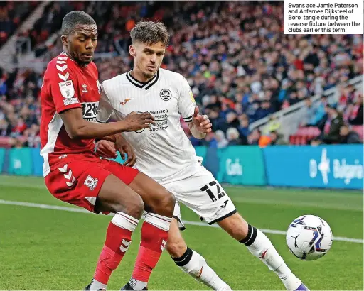  ?? ?? Swans ace Jamie Paterson and Anfernee Dijksteel of Boro tangle during the reverse fixture between the clubs earlier this term