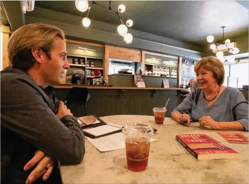  ?? SAVANNAH MORNING NEWS ?? Helen Bradley (right) talks about her first novel, “Breach of Trust,” for which she draws on more than 20 years in victims assistance work.