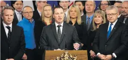  ?? DAVID BLOOM ?? Economic Developmen­t Minister Deron Bilous (at the podium) says internatio­nal travel is necessary to promote Alberta business: “It’s absolutely critical to the long-term prosperity of Alberta. Our province is an export province ... without a buyer,...