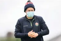  ??  ?? ●●Matt Parkinson at training in a protective mask