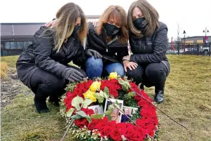  ?? The Associated Press ?? From left, Michelle Pepe, Jill Federman and Lisa Post Mazerolle mourn their respective fathers Monday in Lynnfield, Mass.