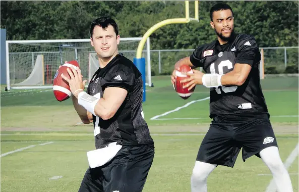  ?? MURRAY MCCORMICK ?? Zach Collaros, left, and Brandon Bridge take part in drills on the first day of mini-camp. Head coach Chris Jones says every position, including QB, is up for grabs.