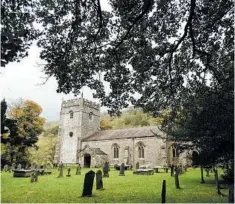  ??  ?? Buildings in Yorkshire, like this Norman church near Arncliffe, have the distinctiv­e gray cast of the local stone. Arncliffe is home to a 18th-century pub, the Falcon.