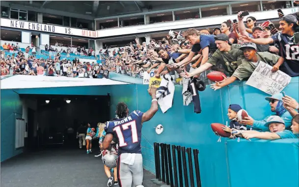  ?? [BRYNN ANDERSON/THE ASSOCIATED PRESS] ?? Patriots wide receiver Antonio Brown waves at fans at the end of a game against the Dolphins on Sept. 15 in Miami Gardens, Fla.